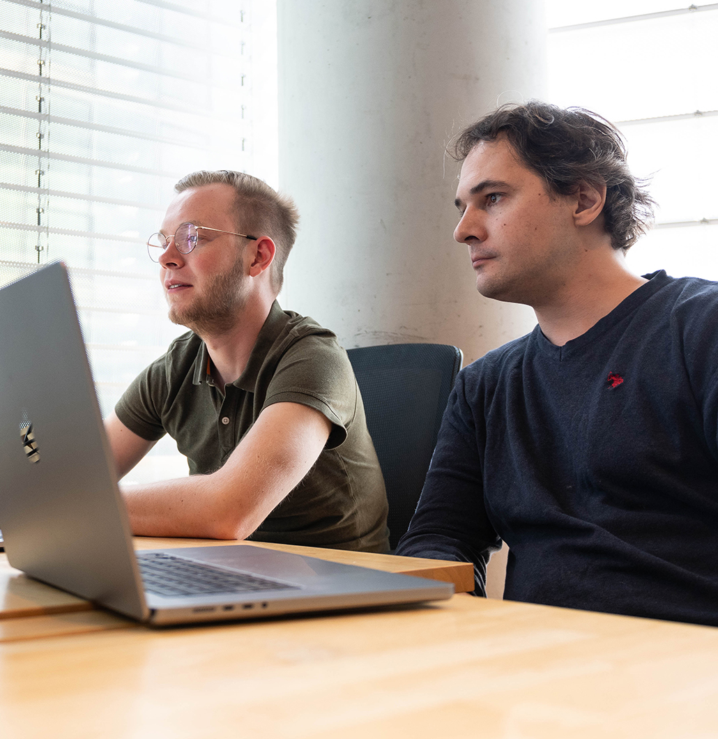 Flatiron employees reviewing work